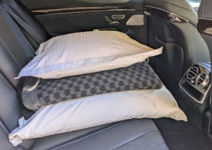 On the back seat, I like to have a couple of pillows and a good car blanket - just in case...