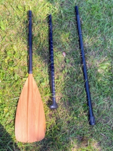 Here's the adjustable paddle. The general rule is that the paddle should be six to 10 inches above the height of the paddler - a little longer for flat water use and shorter for use in the surf. The blade is typically bent at a slight angle to the shaft to allow for more forward reach when taking a stroke.