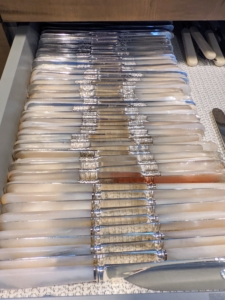 Here is the drawer of mother of pearl knives - easy to see, access and count when preparing for a dinner party. Another tip for storing silver – keep it away from high humidity and high heat.