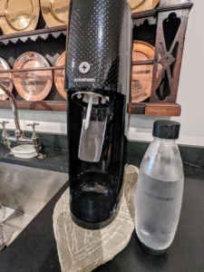 The Soda Stream machine, like a soda syphon, carbonates water by adding carbon dioxide from a pressurized cylinder to create soda water to drink. My grandchildren love the Soda Stream.