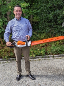 Here's Brian Carolan from STIHL. Brian always delivers the tools and shows us the proper way to use each one. He's holding one of STIHL's hedge trimmers. These hedge trimmers are designed without excess bulk and feature an appropriate power-to-weight ratio for superior maneuverability and cutting power.
