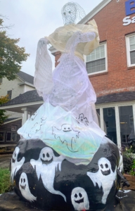 The artist on this 605-pound pumpkin topped it with a gauze-draped ghost.