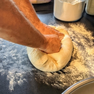 After the dough has doubled in size, Chef Pierre kneads it a bit more and then experiments with the size of the finished muffins.
