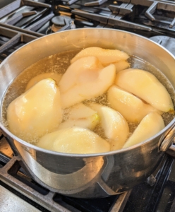 Chef Pierre and Chef Moises also poach pears for the salad. Poaching is gentle, stove-top cooking. These pears are slowly poached until tender - about 20 minutes.