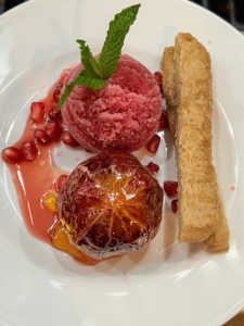 Dessert always looks so beautiful plated up. Pierre uses some of the fresh pomegranate seeds to garnish the sorbet. Each serving is plated with a Moro blood orange and brown butter shortbread cookies.