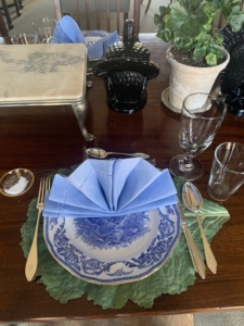 Whenever I entertain, I try to set the table so it is a little different every time. I work with my housekeeper, Enma, on choosing just the perfect combination of plates and linens. Here, we used decorative blue Staffordshire turkey plates with light blue linen napkins on green leaf placemats.