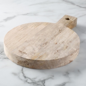 This is my Mango Wood 10-inch Serving Board. Crafted from durable eco-friendly mango wood, this cutting board and server is perfect for sharing artisanal meats and cheeses. And the handle design allows for easy transport.