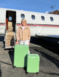 Here I am just before boarding our plane to the Bahamas with my Rimowa luggage. Rimowa calls this "bamboo green." I call it "Martha green" inspired by my love for vintage Fire-King glassware.