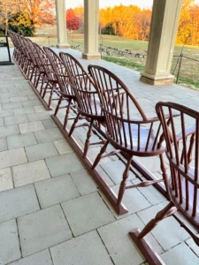 Upon his death in 1799, George Washington’s estate inventory listed 30 Windsor chairs on the piazza. These reproduction chairs are based on an original in the collection that descended in the family of Washington’s enslaved body servant, Christopher Sheels. In July 1800, Martha Washington paid to have the chairs on the piazza painted with mahogany - a paint scheme that was replicated on these reproductions.