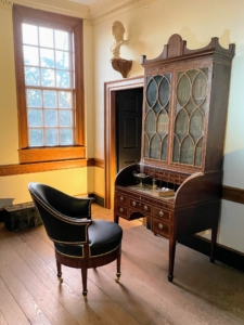 In March 1797, Washington bought this stately secretary-bookcase from Philadelphia cabinetmaker John Aitken for his study at Mount Vernon. His choice, purchased for the exceptional sum of $145, was based on fashionable British neoclassical design. His chair is an early edition of a swivel - this one on four legs.