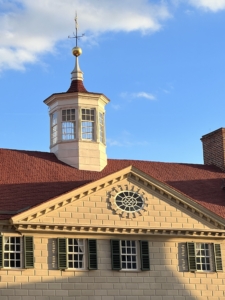 Above the entrance is the bulls-eye window and cupola.