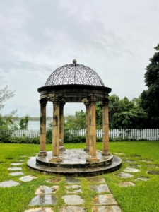 Heir to the A. & P. Tea Company, George bought the property in the 1960s. George envisioned a luxury estate for the business elite and imported European fountains and statues. This gazebo sits on the slope to the harbor.