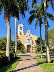 This brightly colored building is the Coral Gables Congregational United Church of Christ built in 1923. It is considered a fine example of Spanish colonial revival architecture and listed on the national register of historic places. The church is the oldest established building and organization in Coral Gables.