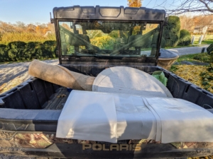 This time of year, it is not unusual to see at least one of our Polaris vehicles filled with "burlapping" supplies. I have many outdoor containers and garden ornaments on the farm. Many of them are large and very heavy, so they are covered and protected with burlap and kept in their respected locations for the duration of the cold season.