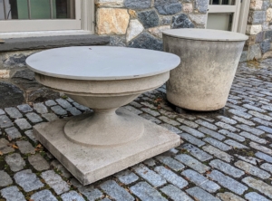 The crew moves down to the stable courtyard to cover these items. Before wrapping this birdbath, it is first completely emptied of water and then covered with a piece of plywood. The plywood is cut to fit the top opening, and can be used from year to year. It is also painted in my signature "Bedford Gray."