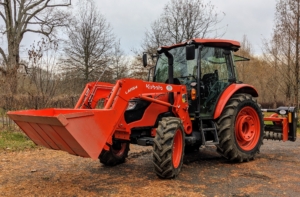 This is our new Kubota M4-071 tractor. It's designed to use auxiliary equipment such as the L1154 front loader that helps us transport so many things around the farm - potted plants, mulch, wood, etc.