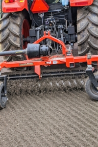 The power rake freshens up the gravel as it turns and brings any compacted gravel to the surface.