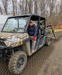 Not far behind, Fernando is doing what we call "dragging" the road. Here he is in our Polaris Ranger. I love these off-road vehicles. We use them every day for so many tasks.