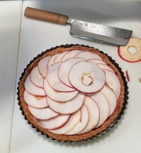 Here is the apple tart I made for dessert. I already had the crust in the freezer, so it was easy to prepare the morning of the dinner. I placed very thin McIntosh apple slices on top and sprinkled them with sugar before baking.
