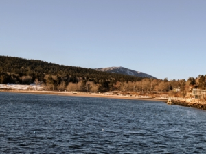Here, Cheryl is on the town dock looking toward the beach. Above it are the Jordan Cliffs and the snow covered Sargent mountain. At 1373 feet, Sargent Mountain is the second highest mountain in Acadia National Park. Seal Harbor Beach is pretty desolate now, but in a few months, this will be crowded with beachgoers once again.