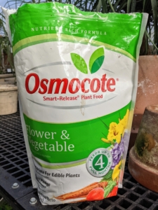 We also add some Scott's Osmocote fertilizer - small, round coated prills filled with nutrients.  You can find Osmocote on Martha.com.