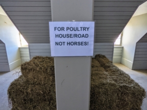 In another area, any hay that is no longer suitable for the horses is separated. This hay is used as nest bedding for the geese and peahens, as insulation around my hoop houses, and to direct any water runoff on the carriage roads.