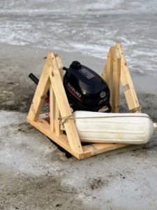 This outboard motor is 2.5 horsepower. It doesn't need a lot to rotate the ice. As a precaution, it's attached to its own buoy.