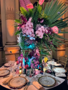 And a fun arrangement of orchids, ferns, and palms topped this table by Jerome LaMaar. I have cared for orchids for many years and always learn something new whenever I come to the dinner and when I walk through the beautiful Orchid Show exhibit.