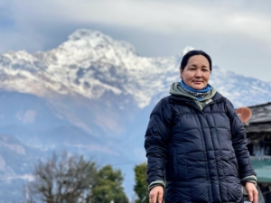 This is Chhiring's wife, Ang Pema, standing in front of this stunning view of the mountains. Nepal is home to Mt. Everest and to many other mountains, from the 3000-foot summits of the Churiya Hills to the giants of the Greater Himalayas and the ranges along the border with Tibet.