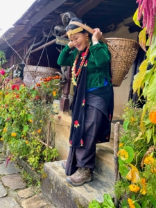 Here is Ang Pema trying the traditional female Gurung dress and basket used for carrying goods from the market.