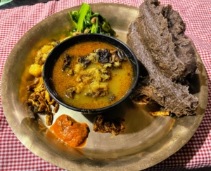 Some of the local Gurung food includes this buckwheat porridge, served with vegetables and dry buffalo meat.