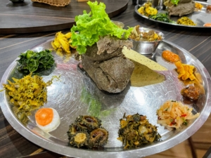 Here's another dish of traditional Nepali buckwheat porridge with a variety of other appetizers - it is among the most popular dishes in Nepal.