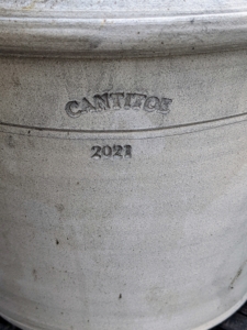 He stamps the year the pot was made on the side. And, usually he stamps my name, or Cantitoe, the name of my farm above it.