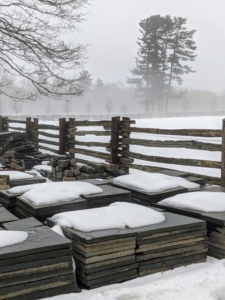 This is my stone yard, a place where extra inventory of the many types of stones used at the farm are kept - slate shingles, marble flooring, granite posts, etc. The thick fog can be seen in the distance.