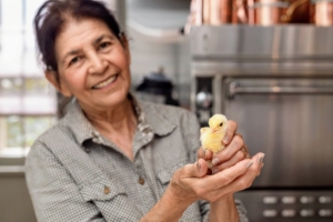 She always had such a gentle touch. Her grandson, Lucas, captured this photo as Laura held one of the many chicks hatched in my kitchen.