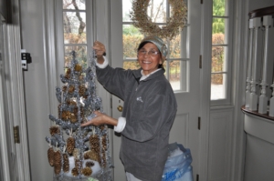 In this photo, Laura places tinsel on an ornamental tree. She decorated hundreds of Christmas trees over the years - many of them were photographed for my magazine.