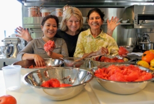 Sanu, Laura, and I worked on many projects in my kitchen. Here we are preparing the tomatoes from the garden for making sauce.