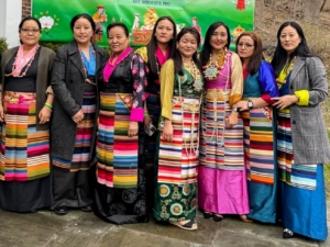 Many attendees wore traditional Sherpa clothing. Married women tie a multi-colored striped apron of woolen cloth called "pangden" around their waists.