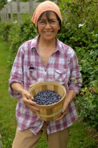 On this day, Laura was busy picking blueberries in the blueberry patch. This photo was taken by my late sister, Laura Plimpton. It was one of Laura Acuna's favorite pictures.