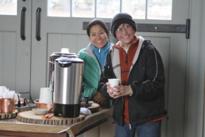 Sanu and Laura prepare coffee in the stable for a big tour of the farm in 2013.