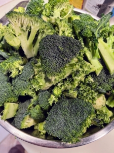 These broccoli heads are cooked until fork tender also and placed in a big stainless steel bowl. All my food is completely organic and full of flavor.