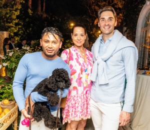 In this photo - influencers Isaac Boots, Pippa Cohen, and Jeffrey Patrick O'Brecht. Isaac's poodle, Davis Boots, sat on his lap throughout the entire dinner. (Photo by Carrie Bradburn/CAPEHART)