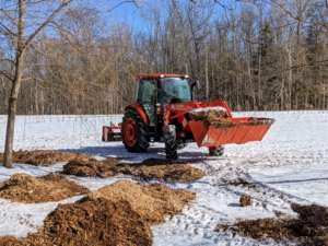 Over the last few weeks, the crew has been able to get many of the outdoor chores done around the farm. Here comes Chhiring in our new our Kubota M4-071 tractor. He's transporting wood chips to various areas of the middle field. This is best done when the ground is still frozen, so the wight of the tractor does not create big ruts in the soil. My tractors get lots of use at the farm for pulling or pushing agricultural machinery or trailers, for plowing, transporting mulch and compost, and so much more.