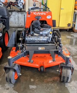 On this side of the Barn, we keep our fleet of Kubota mowers. They are all parked by the back entrance to the barn during the summer season when they are used daily. Here is my SZ22NC-48 stand-on mower. We use this to mow areas where the riding mower cannot go.