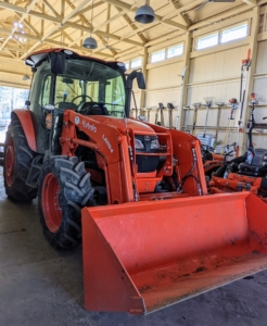 This is our Kubota M4-071 tractor. It’s designed to use auxiliary equipment such as the L1154 front loader that helps us transport so many things around the farm – potted plants, mulch, wood, etc.