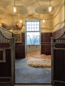 Each horse has its own 12-foot by 12-foot stall. The stalls are mucked and cleaned every day. Fans are essential in stables, so each stall is also outfitted with a fan to maintain good airflow and to keep the horses cool in warm weather.