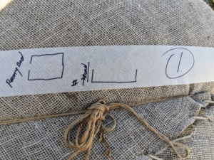 Here is the label on one of the rolls. The sections of burlap are also tied with jute twine – we use this natural twine for many projects at the farm.