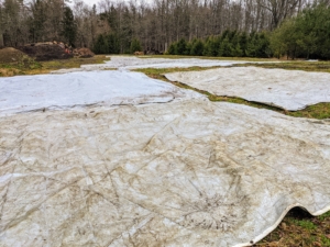 These tarps are laid out to dry before they are folded and stored.