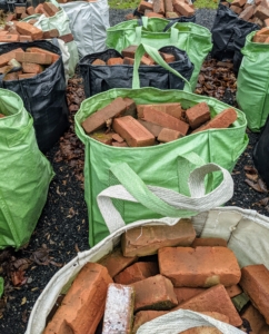 Another item NOT for the tub grinder - these bricks. These are from my former East Hampton property. When we brought them back to the farm, we transported them to this storage area in my Multi-Purpose Reusable Heavy Duty Tote Bags - they really do hold more than 900-pounds each.