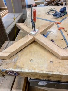 Here, the trestle pieces are joined and glued. Fortunately, yew glues, finishes, and turns quite nicely.